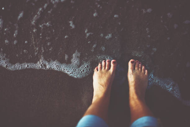 Bare feet at the beach by the Baltic Sea