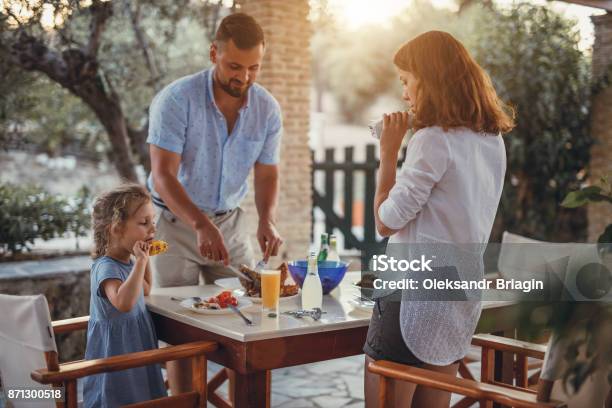 Father And Dauther Having Mediterranean Dinner On A Terrace Stock Photo - Download Image Now