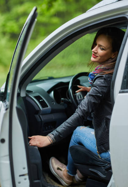 istock Young woman and her new car 871304078