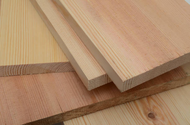 istock stack of lumber in timber logs storage for construction or industrial work , texture background 871304326