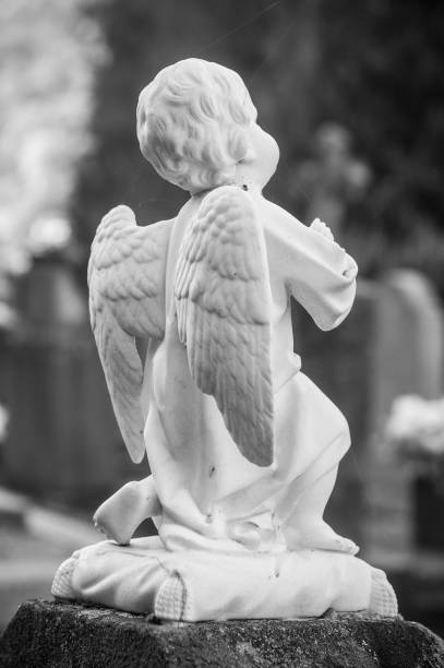 istock stoned angel in a cemetery 871308276