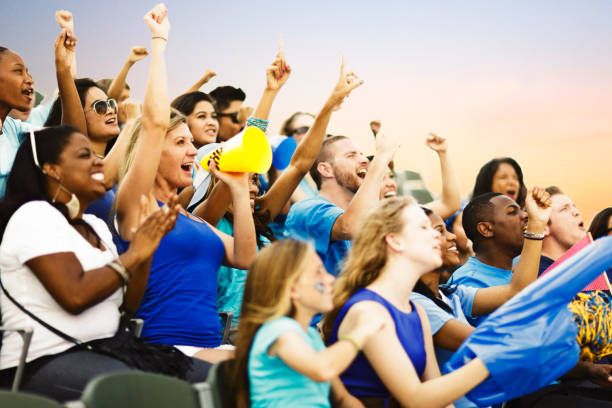 Crowd Cheering Crowd of people cheering for their team. american football stadium stadium sport outdoors stock pictures, royalty-free photos & images