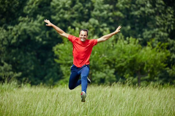 istock Happy man jumping for joy 871315506