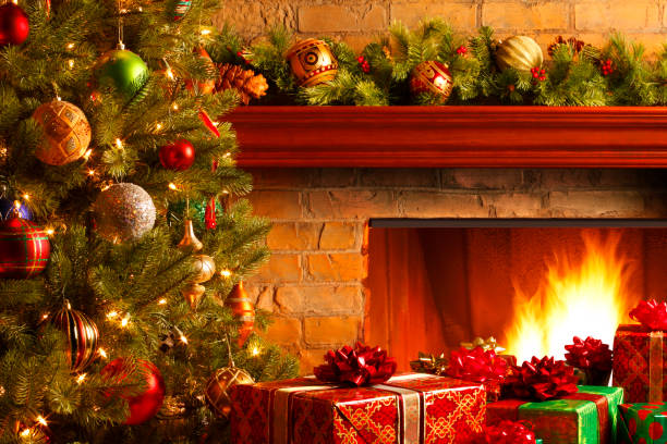 istock Christmas Tree And Presents In Front Of Fireplace 871316440