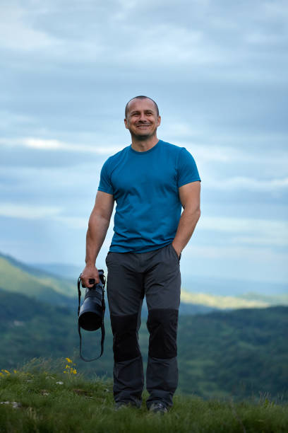 istock Wildlife photographer with camera 871316578