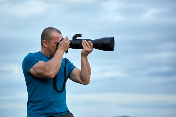 istock Wildlife photographer with camera 871316642