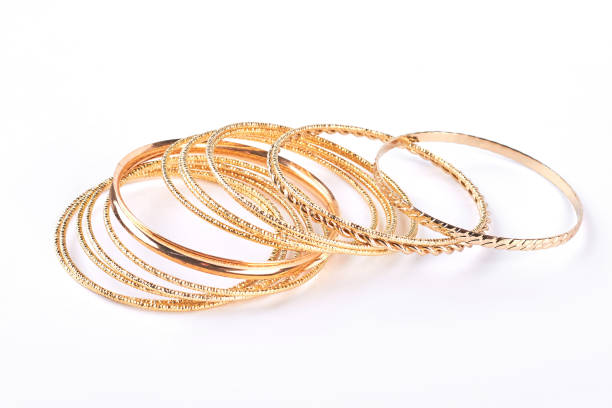 istock Gentle golden bracelets over white background. 871319492