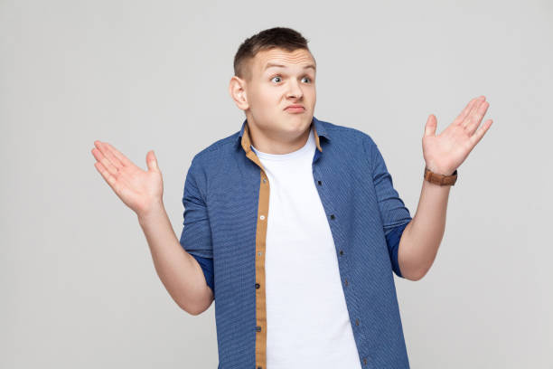 istock Its not me! Confused boy looking at camera 871323756