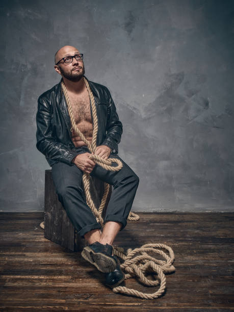 istock A stern man in a leather jacket. 871327502