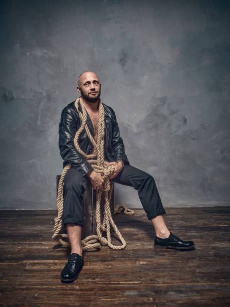 istock A stern man in a leather jacket. 871328194
