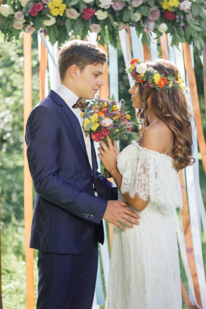 istock Beautiful wedding couple - bride and groom during wedding ceremony 871328466