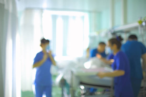 Medical professionals providing care to a young woman in a hospital.