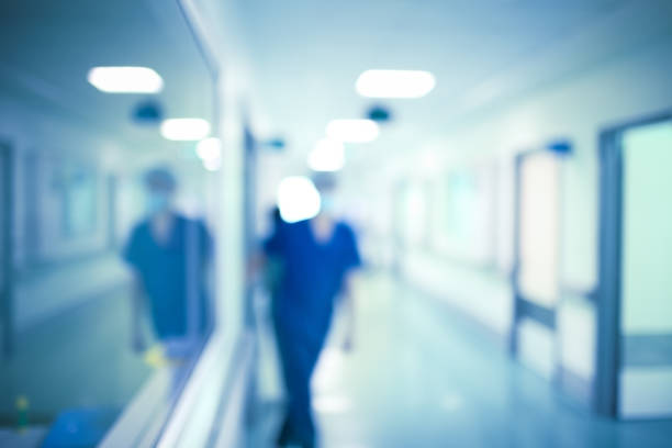 istock Medical worker in the hospital hall, unfocused background 871335564