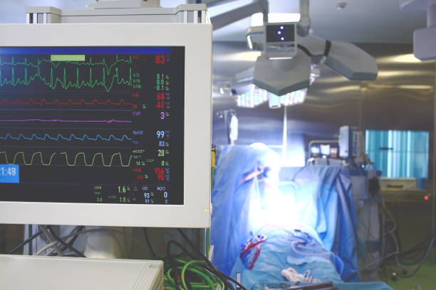 istock Working process in hospital operating theatre with people and technology 871335740