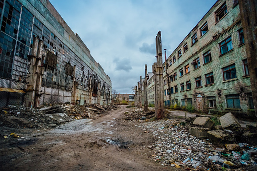 Territory of abandoned industrial area waiting for demolition. Junk at former Voronezh excavator factory.