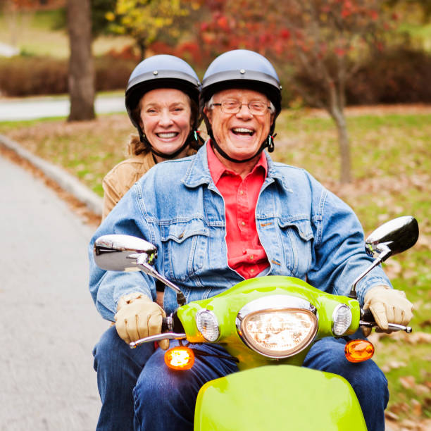 istock Happy Senior Couple on Scooter 871350156