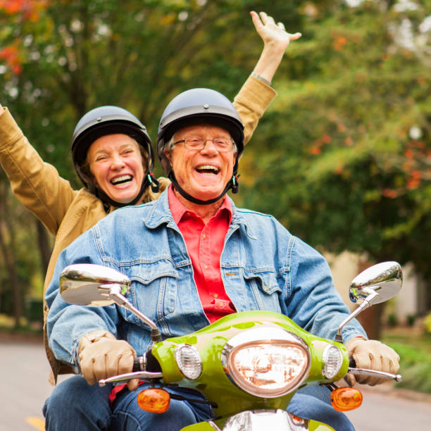 istock Happy Senior Couple on Scooter 871350160