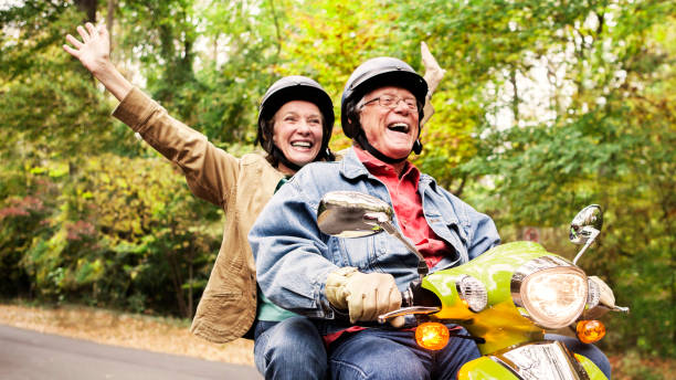 Happy Senior Couple on Scooter
