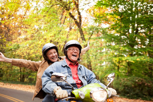 istock Happy Senior Couple on Scooter 871350182