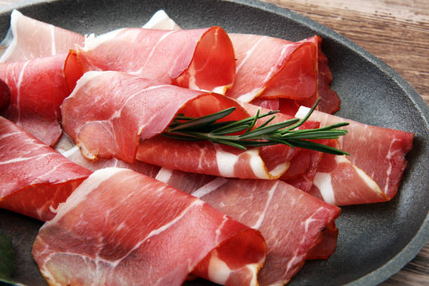 istock prosciutto with rosemary  or ham of black forest or serrano 871350348
