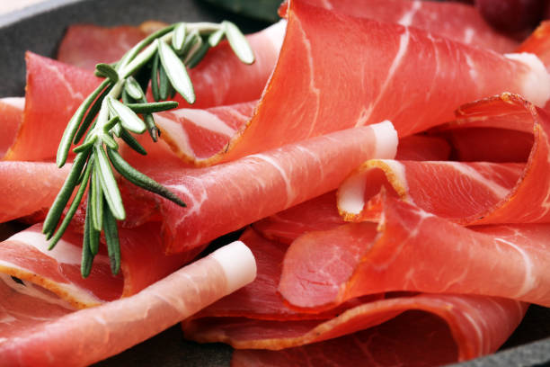 istock prosciutto with rosemary  or ham of black forest or serrano 871350406