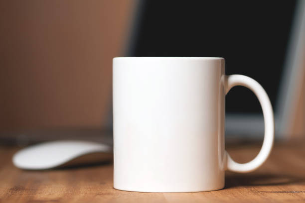 White mug on the desktop White mug on the wooden table mug stock pictures, royalty-free photos & images