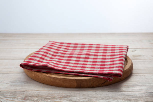 istock Pizza board with a napkin on white wooden table. Top view mock up 871358700