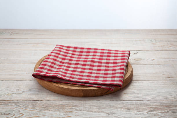 istock Pizza board with a napkin on white wooden table. Top view mock up 871358726