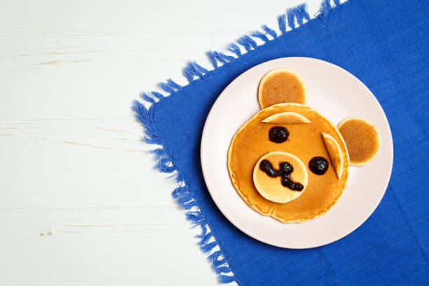 istock Baby bear on a pink plate 871358926