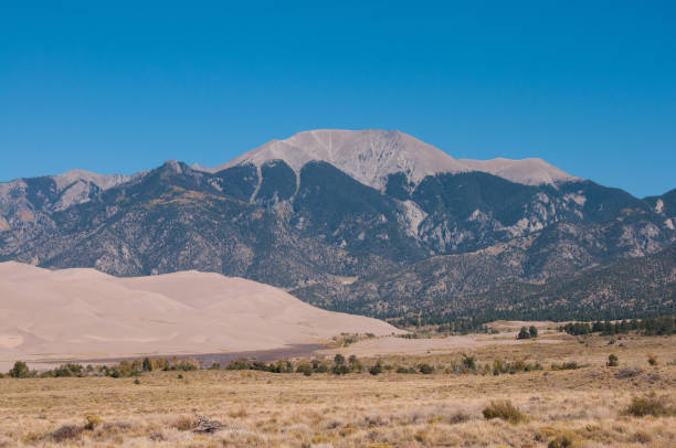 istock Great Sand Dunes and Mountain 871361758