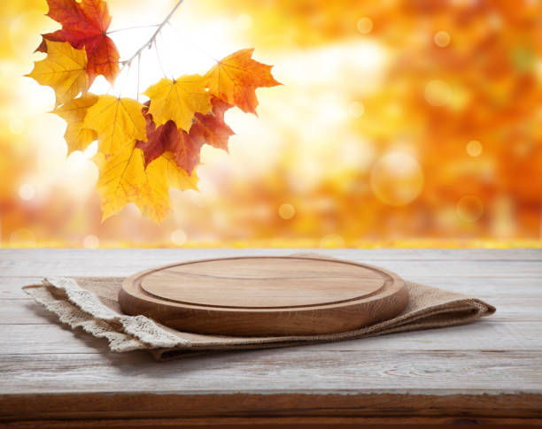 istock Pizza board with tablecloth on wooden table and autumn background - can used for display or montage your products 871364894