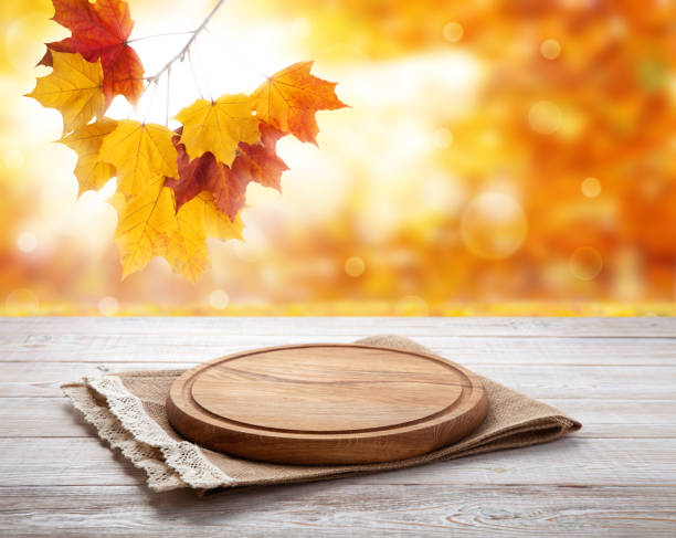 istock Pizza board with tablecloth on wooden table and autumn background - can used for display or montage your products 871364908