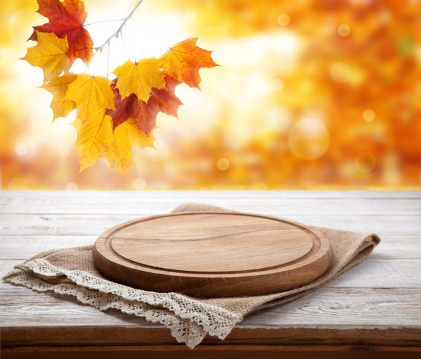istock Pizza board with tablecloth on wooden table and autumn background - can used for display or montage your products 871364920
