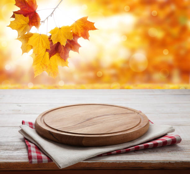 istock Pizza board with tablecloth on wooden table and autumn background - can used for display or montage your products 871364924