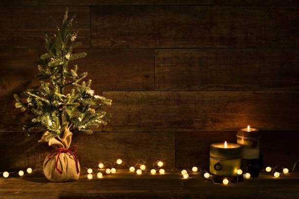 istock Christmas tree on retro wood background with bulb lights 871365386