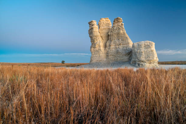 Castle Rock in Kansas prairie Castle Rock  - limestone pillar landmark in prairie of western Kansas near Quinter (Gove County), windy fall morning before sunrise Castle Rock stock pictures, royalty-free photos & images