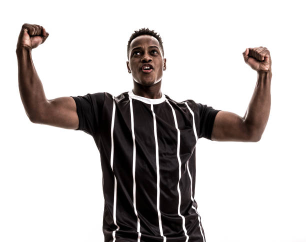 istock Fan / Sport Player on black and white uniform celebrating on white background 871369950