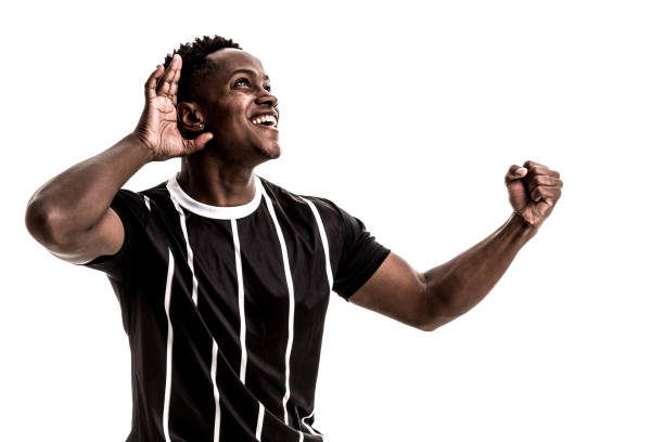 istock Fan / Sport Player on black and white uniform celebrating on white background 871369986