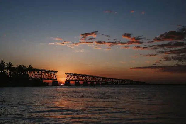 Old Bridge at Bahia Honda State Park in Florida Keys with the sun on the horizon