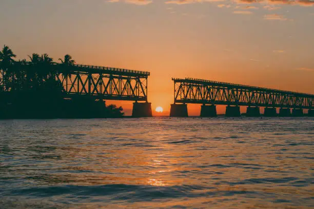 Old Bridge at Bahia Honda State Park in Florida Keys with the sun on the horizon