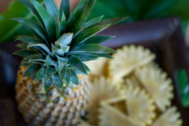 istock Pieces and halves of pineapple macro, on a tropical summer background 871373452