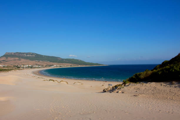 Beach. Beach. Summer beach view. Beach Bologna, Tarifa, Spain. Picture taken – 2 september 2017. luz solar stock pictures, royalty-free photos & images