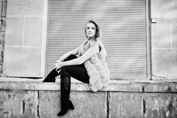 istock Blonde girl at fur coat 871380682