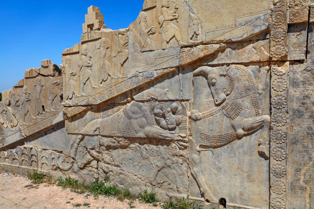 istock Old bas relief sculpture carving on wall, Persepolis city, Iran. 871381248