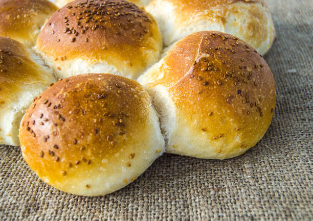 istock world bread varieties, different types of bread on wooden floor 871387496