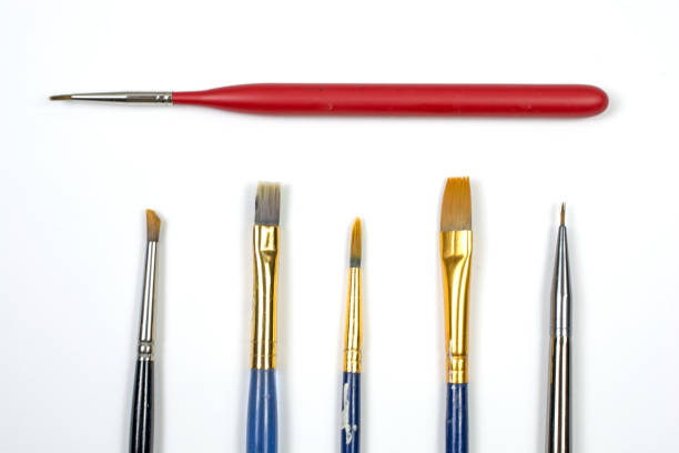 istock Small artists' paint brushes on a white background 871394154