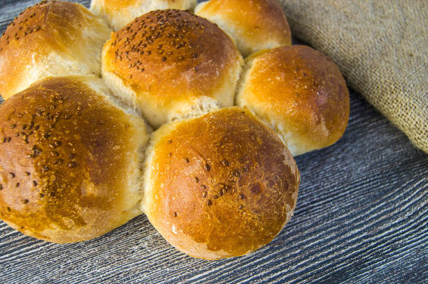 istock world bread varieties, different types of bread on wooden floor 871396386