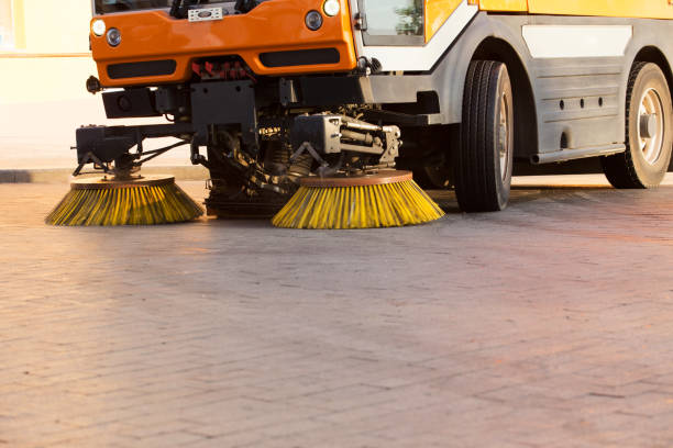 Street cleaner vehicle Yellow urban sweeper cleans road from dirt with a round brush carpet sweeper stock pictures, royalty-free photos & images