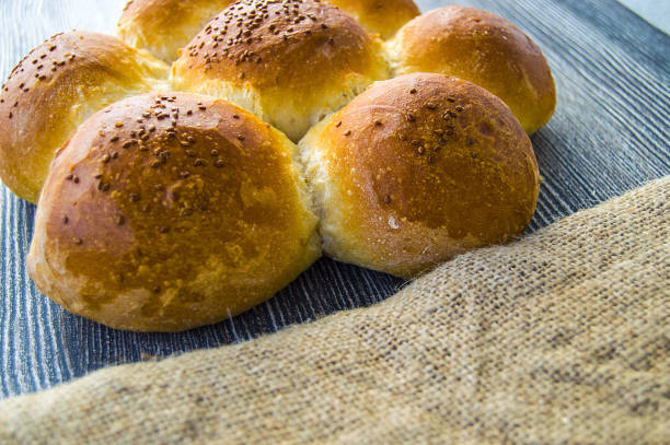istock world bread varieties, different types of bread on wooden floor 871398550