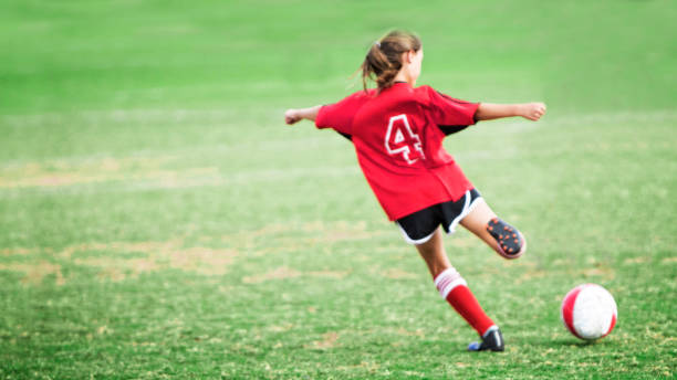 istock Little girl playing soccer. 871398856